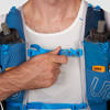 Close up of man wearing Ultimate Direction Mountain Vest 5.0, showing sternum strap buckle