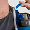 Close up of man wearing Ultimate Direction Mountain Vest 5.0, showing plastic rescue whistle