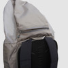 Close up of Ultimate Direction All Mountain pack, showing zipper pocket on the top of pack lid