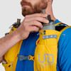 Close up of man placing water bottle in pocket of Ultimate Direction Fastpack 20