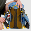 Close up of man showing back panel of Ultimate Direction Fastpack 30