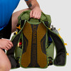 Close up of man holding Ultimate Direction Fastpack 40, pulling strap aside to show back panel