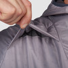 Close up of Man wearing Ultimate Direction Men's Ventro Jacket, showing ventilation flap on front of jacket