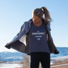 Woman wearing Ultimate Direction Women's Casual Tank, Heather Gray, in the mountains