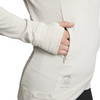 Close up of woman putting hand in pocket of Ultimate Direction Women's Ultra Hoodie