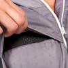 Close up of Woman wearing Ultimate Direction Women's Ventro Jacket, showing ventilation flaps on front of jacket