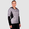Woman wearing Ultimate Direction Women's Ventro Jacket, front view, with jacket zipped