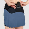 Close up of Ultimate Direction Women's Hydro Skirt, showing woman placing phone in pocket
