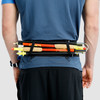 Man wearing Ultimate Direction Comfort Belt Plus, rear view, with trekking poles attached to belt
