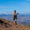 Woman running in Ultimate Direction Women's Cumulus Tank