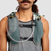 Close up of man wearing Ultimate Direction Highland Vest, showing pockets and hydration tube
