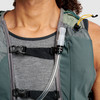 Close up of man wearing Ultimate Direction Highland Vest, showing pockets and hydration tube 3