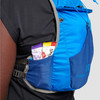 Close up of woman wearing Ultimate Direction Trail Vest, showing pocket on waistbelt