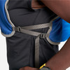 Close up of woman wearing Ultimate Direction Trail Vest, showing side strap
