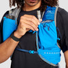 Close up of Ultimate Direction Ultra Vest, showing man holding tube