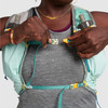 Close up of woman wearing Ultimate Direction Ultra Vesta, buckling sternum strap