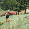 Woman running in Ultimate Direction Women's Velum Short
